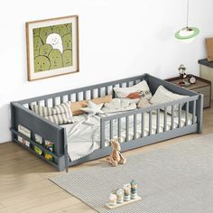 a baby's room with a gray crib and white rugs on the floor