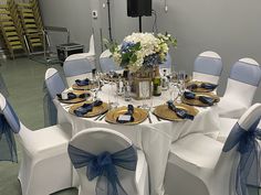 the table is set with blue and white linens