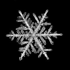 a snowflake on a black background