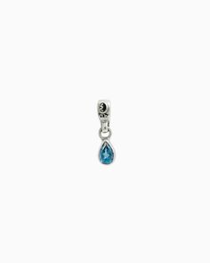 The Teardrop Stone Charm features a faceted pear-shaped blue zircon stone on a petroglyph accented loop. Pair with your favorite hook bracelet or dainty chain, sold separately. Metal: Sterling silver Stone: Blue zircon Dimensions: 16mm x 4mm Stone Size: 6mm x 4mm Style #: C120BZ Sterling Silver Teardrop Charms Jewelry, Everyday Teardrop Charm Jewelry, Everyday Teardrop Charms Jewelry, Sterling Silver Drop Jewelry With Dangling Charms, Silver Pear-shaped Blue Topaz Jewelry, Pear Shaped Blue Topaz Jewelry Gift, Pear-shaped Blue Topaz Jewelry As A Gift, Pear-shaped Blue Topaz Jewelry For Gifts, Pear Shaped Blue Topaz Jewelry For Gifts