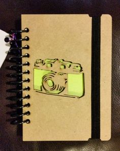 a notebook with a camera drawn on it