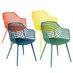 four different colored chairs sitting next to each other