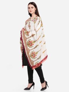 This Off-White shawl/dupatta is crafted in organic khadi cotton fabric. It is Heavily aari Embroidered with different kalash motif. It is fenced with wine dyed cotton tassel lace and fringe lace on both the ends. For winters it is perfect as a fancy shawl and for festive it is perfect to carry on your fancy outifit. Color: Off-white Fabric: 100% cotton base khadi Fabric Work Details: Embroidered, embellished with fancy laces and fringes Meausrements: Length - 200 CM Width - 75 CM Note: The produ Traditional White Dupatta With Woven Motifs, White Traditional Wear With Woven Motifs For Diwali, White Dupatta With Woven Motifs, White Shawl For Traditional Ceremonies, Festive White Dupatta With Woven Motifs, Festive White Traditional Wear With Woven Motifs, White Pashmina Dupatta Shawl, White Traditional Wear With Woven Motifs For Navratri, Cream Shawl-shaped Dupatta For Festive Occasions