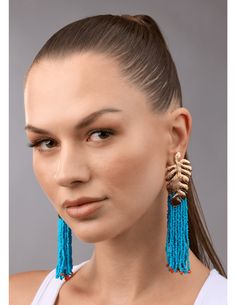 Steven Dann Palm Leaf Beaded Statement Earring in Gold/Ocean. All Sale Merchandise is FINAL SALE. Gold toned textured palm leaf post. Cerulean blue beaded tassels. Orange bead details. Classic post. Approx. 4" long. Blue Beaded Fringe Earrings For Beach, Blue Beaded Fringe Jewelry For Beach, Blue Tassel Earrings With Dangling Beads For Beach, Turquoise Earrings With Beaded Fringe For Beach, Turquoise Tassel Earrings With Colorful Beads For Beach, Turquoise Fringe Beaded Earrings For Beach, Blue Fringe Beaded Earrings For Beach, Rococo Sand, Minnie Rose