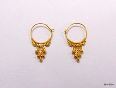 Traditional 18kt Gold Hoop Earrings From India. This Light weight Earring pair is handcrafted in traditional design in 18kt yellow gold. Great Handmade Design, Gives Etnic And Elegant look on the field. Good For Jewellery Collection. Best Gift Item For Your Loved Ones. Daily or Party Wear, Easy To Wear. Note - You Can Even Buy Single Piece. weight for pair - 1.110 grams height max. - 22 mm width max. - 12 mm material - 18kt Yellow gold. handmade - yes department - women (female) Yellow Gold Round Jewelry With Latkans, Yellow Gold Jewelry With Latkans, Traditional 14k Gold Dangle Jewelry, Traditional Small Hoop Hallmarked Earrings, Yellow Gold Pierced Jewelry For Festivals, Traditional Hallmarked Round Hoop Earrings, Pierced Yellow Gold Jewelry For Festivals, Traditional Small Hoop Huggie Earrings For Gifts, Traditional 14k Gold Earrings For Anniversary