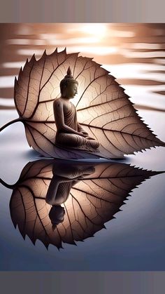 a buddha statue sitting on top of a body of water with a leaf in front of it