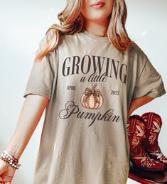 Growing a Little Pumpkin Halloween Pregnancy Shirt, Fall Pregnancy Announcement 2024, New baby Mommy Tee, Fall Mom to Be Gift 🤍 ♥ DESCRIPTION: This is a Comfort Colors Unisex t-shirt that is 100% ring-spun cotton, soft-washed, garment-dyed fabric brings extra coziness to your wardrobe while the relaxed fit makes it an excellent daily choice. The double-needle stitching throughout the tee makes it highly durable while the lack of side-seams helps the shirt retain its tubular shape. ♥ BRAND: Comf Graphic Print Tops For Birthday In Fall, Fall Crew Neck Birthday T-shirt, Crew Neck Birthday T-shirt For Fall, Cute Fall Birthday Tops, Halloween Pregnancy Shirt, Fall Pregnancy, Fall Pregnancy Announcement, Baby Mommy, Pregnant Halloween