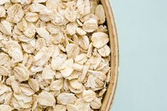 oatmeal in a wooden bowl on a blue background