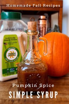 homemade fall recipes pumpkin spice and simple syrup are on the table with an orange pumpkin in the background