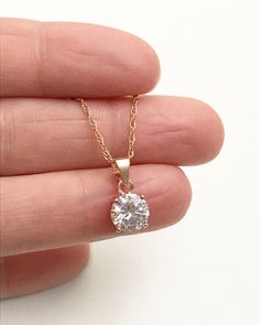 "Rose Gold CZ Solitaire Necklace Simple, Minimalist and Dainty Necklace Metal: *14k Rose Gold Plated .925 Sterling Silver Pendant (vermeil) *14k Rose Gold Filled Chain (not plated) (*Gold-filled jewelry have a much thicker layer of gold on them, it is just a step down from solid gold when it comes to quality without the price tag) Stone: 7mm cubic zirconia Measurement: pendant height is 14mm (0.55\") including bail and 7mm (0.28\") wide You can find other Dainty Minimalist Jewelry in my Shop her Jewelry Rose Gold, Solitaire Necklace, Cz Necklace, Solitaire Necklaces, Necklace Wedding, Wedding Bridal Jewellery, Necklace Simple, Necklace Dainty, Simple Necklace