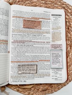 an open bible on top of a woven basket