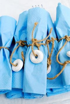 blue napkins with white buttons tied together