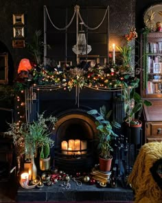 a fireplace decorated with christmas decorations and candles