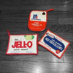 three small pouches are sitting on the floor next to each other and one has a label that says jello