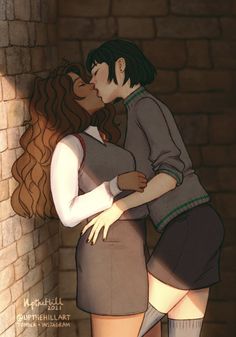 a man and woman kissing in front of a brick wall