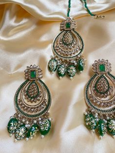 This maangtikka set comes with matching statement earrings and is beautiful and elegant for any occasion. The design is unique and the bright colors can match with anything. Limited prices in each color so grab yours now. Perfect for the festive season during holidays, navratri, and diwali. Elegant Chandbalis For Diwali Festivities, Eid Kundan Chandbali Sets, Traditional Jhumkas For Eid Festival, Traditional Jhumkas For Eid Festivities, Elegant Chandbalis For Navratri Festive, Elegant Navratri Festive Chandbalis, Elegant Festive Chandbalis For Navratri, Chandbali Zari Work Tikka, Festive Chandbali Jewelry Set With Mirror Work