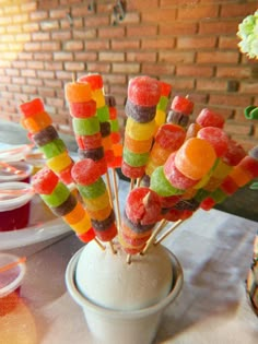 there are many colorful candy sticks in the vase