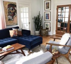 a living room filled with furniture and lots of windows