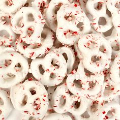 white donuts with red sprinkles on them