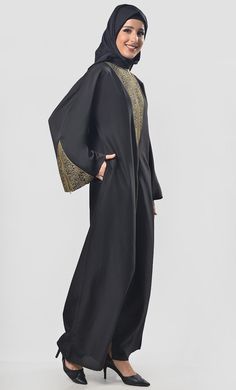 A well chemistry of simplicity in modest wear. The abaya includes lace and golden chain detailing on yoke and sleeves, front open zipper for easy to wear and included hijab for enhancing the look and included pockets for better utility. Color: Black Pattern: Normal Abaya Abaya Type: Front Close(ZIPPER) Work: Intricate lace And golden chain Fabric : KASHIBO This Abaya Has Round Neckline and Full sleeves. This Abaya is with Hijab. Wash Care: Dry Clean Only. Complete The Look:- Looking for somethin Elegant Gold Abaya For Formal Occasions, Elegant Gold Formal Abaya, Modest Black Abaya For Formal Occasions, Elegant Long Formal Thobe, Elegant Long Thobe For Formal Occasions, Elegant Long Thobe For Formal Events, Elegant Gold Abaya, Elegant Gold Long Sleeve Abaya, Elegant Long Sleeve Gold Abaya