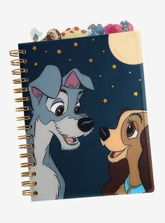 a spiral notebook with an image of lady and the tramp on it's cover