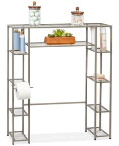 a metal shelving unit with three shelves and a potted succulent plant