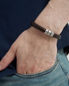 The perfect men's gift for a loved one! Made of premium leather and customizable silver beads, this handmade bracelet makes a unique and meaningful gift for a friend, spouse or family member. It also makes a great gift for birthdays, anniversaries, Christmas, Valentine's Day, Mother's Day, Father's Day and other special occasions. This personalized bracelet features a beautifully braided leather cord that is held in place by a sturdy magnet. ★ Important Notes: * Our this bracelet is an adjustabl Masculine Braided Leather Bracelet For Gift, Adjustable Brown Jewelry For Anniversary, Adjustable Braided Bracelet With Stainless Steel Clasp, Father's Day Adjustable Engraved Braided Bracelets, Father's Day Engraved Adjustable Braided Bracelets, Father's Day Engraved Adjustable Braided Bracelet, Father's Day Gift Bracelet With Leather Strap, Father's Day Leather Strap Bracelet Gift, Masculine Bracelets For Father's Day Gift