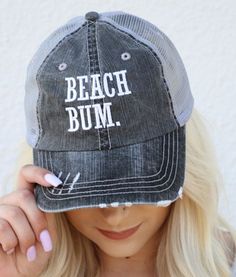 "Beach Bum" Trucker hat with mesh back and velcro closing. Professionally Embroidered with Industrial machine. Grey Distressed Trucker Hat. 80% cotton/20% polyester, Herringbone fabric 100% polyester mesh back Unstructured, six-panel, low-profile Pre-curved fray visor with contrasting undervisor Velcro closure. This is a Final Sale Item!! Vacation Accessories, Herringbone Fabric, Industrial Machine, Beach Bum, Baseball Hat, Trucker Cap, Herringbone, Caps Hats, Trucker Hat