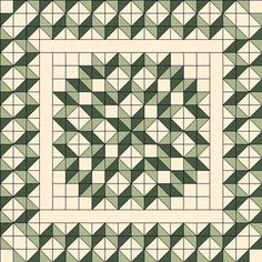 a green and white quilt with squares on it