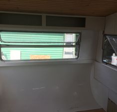 the inside of a trailer that has a window in it