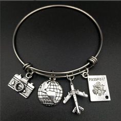 Brand New Travel Charm Silver Bangle Bracelet. Charms Included Passport, Camera, Airplane And Globe World Traveler Bracelet Love Of Exploring, Adventure Explorers Travel Bracelet Great Gift For The World Traveler Or Yourself Silver Metal Jewelry For Travel, Adjustable Silver Jewelry For Travel, Travel Charm Bracelet, Travel Inspired Jewelry, Travel Bracelet, Wall Pics, Travel Charms, Accesories Jewelry, Wire Bangles