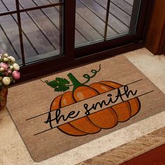 a door mat that says, the smith on it next to a potted plant