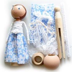 the doll is next to some sewing supplies