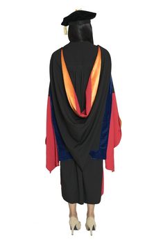 a person in a graduation gown with a black hat and orange tassel on his head