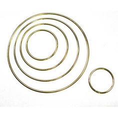 an assortment of metal rings and washers on a white background