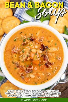 a bowl of bean and bacon soup with crackers on the side