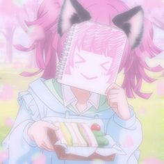 a girl with pink hair holding a piece of cake