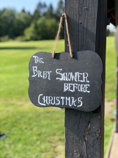 a sign hanging from the side of a wooden pole that says, bridle shower before christmas