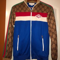 Blue, Red And White Intarsia With Green And Red Down Sleeves. Gucci Logo On Chest. Purchased Brand New At Gucci In Rome, Italy. Worn Twice. Immaculate Condition. Rare. Original Box, Tags, Bags Included. Have Original Receipt For Authenticity. Gucci Long Sleeve Track Jacket For Fall, Gucci Long Sleeve Track Jacket For Winter, Gucci Casual Winter Track Jacket, Gucci Casual Track Jacket For Winter, Casual Gucci Winter Track Jacket, Casual Long Sleeve Gucci Track Jacket, Blue Gucci Winter Outerwear, Gucci Multicolor Fall Outerwear, Gucci Multicolor Outerwear For Fall