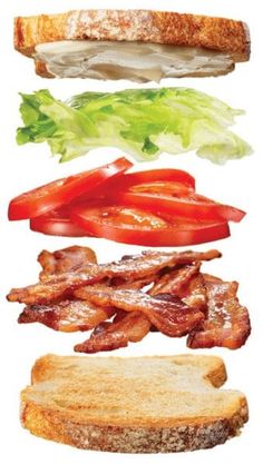 a sandwich with bacon, lettuce and tomato slices on it's side