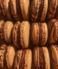 a box filled with lots of different flavored macaroons