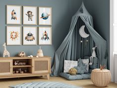 a child's room with blue walls and pictures on the wall