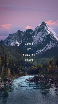 a man standing on the edge of a river in front of mountains with words saying saved by amazing grace