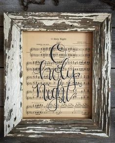 an old wooden frame with sheet music and the words good night written in black ink