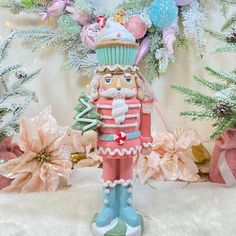 a nutcracker figurine is standing in front of some christmas tree decorations