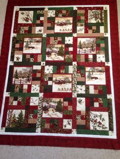 a red and green christmas quilt on the floor