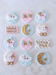 some cookies that are shaped like teddy bears and crescents with the words twinkle twinkle little star on them