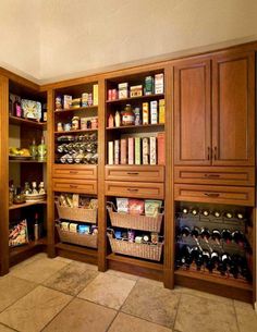 a kitchen with lots of wooden cabinets and shelves