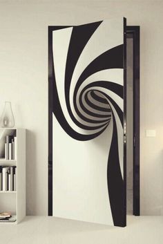 an open door with black and white swirls on it