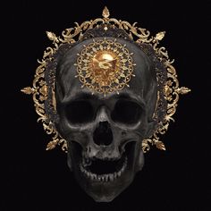 a skull with gold decorations on it's head